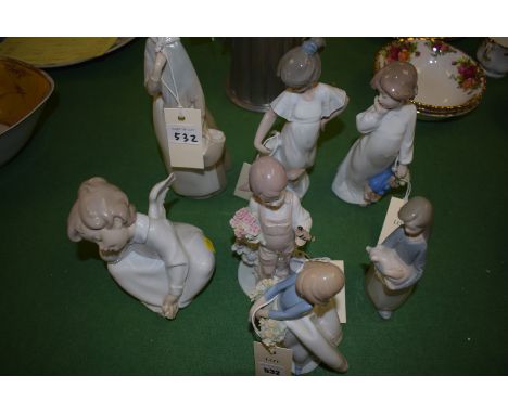 Five Lladro figures; and two Nao figures.