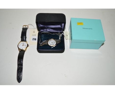 A Tiffany & Co. Portfolio steel cased wrist watch with Arabic dial and steel tapering strap in original box; together with a 