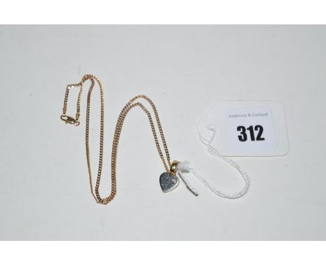 A 9ct. yellow gold heart-shaped pattern pendant, set single diamond on a 9ct. gold chain, 5.4grms gross.