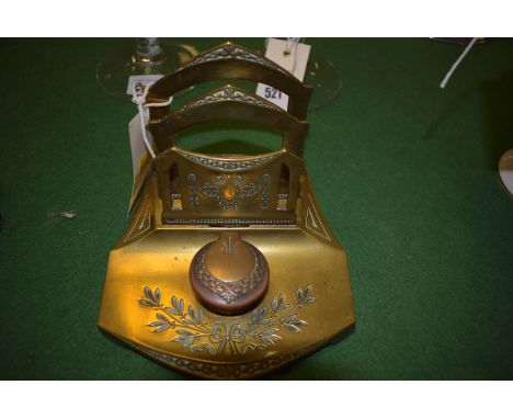 A Victorian brass letter stand and inkwell, with ribbon and swag decoration.