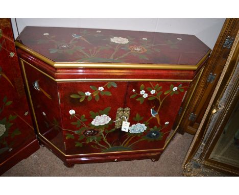 A pair of modern chinoiserie side cabinets with a pair of central cupboard doors and canted corners and raised on shaped brac