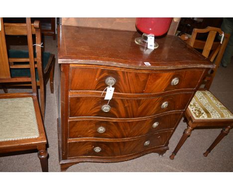 A reproduction inlaid mahogany serpentine front chest of four graduating drawers with ring pull handles, raised on bracket fe