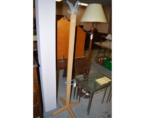 A modern coat rack with stick receiver.