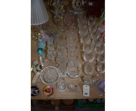 A quantity of crystal glass ware including wine glasses, tumblers, decanter, table lamp, four branch candelabra, paperweights