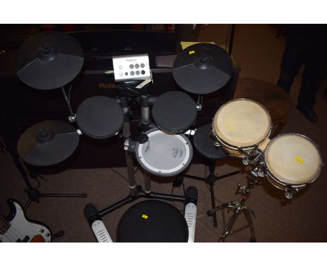 A Roland electronic drum kit, with stool; two microphones on stands; together with a pair of Stagg bongos on stand.  (5)