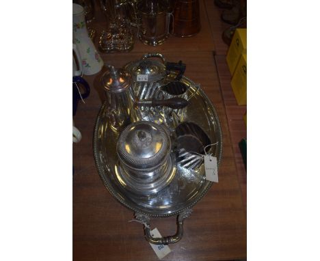 Silver plated ware to include a large oval tray, a three piece tea service, a biscuit barrel, and a cafe au lait with turned 