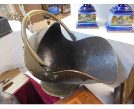 A brass helmet shaped coal scuttle, COLLECT ONLY.