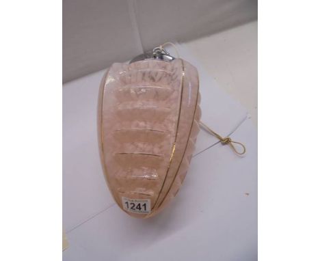 An Art Deco pink glass hanging lamp shade with chrome fittings.