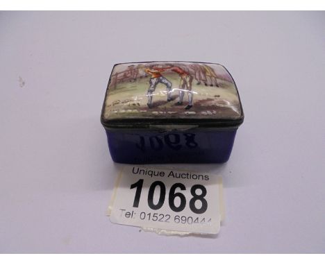 An early Victorian enamel patch box featuring a wrestling scene, 5 x 4 x 3 cm.