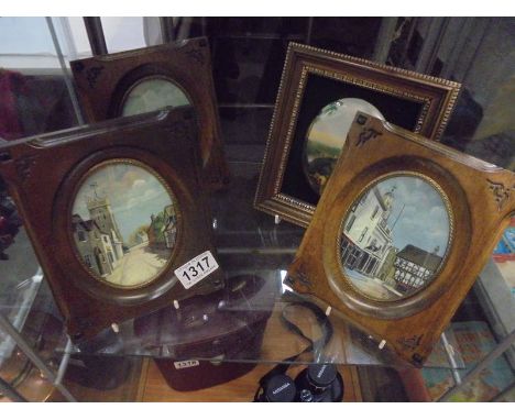 Four framed ceramic pictorial plaques.