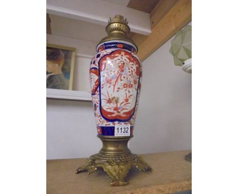 A 19th century Chinese Imari vase oil lamp base with brass fittings.There are no drill holes or visible damage, wick winder i