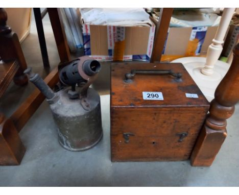 A vintage oak cased L M Ericson Stockholm crystal receiver and a brass blow lamp