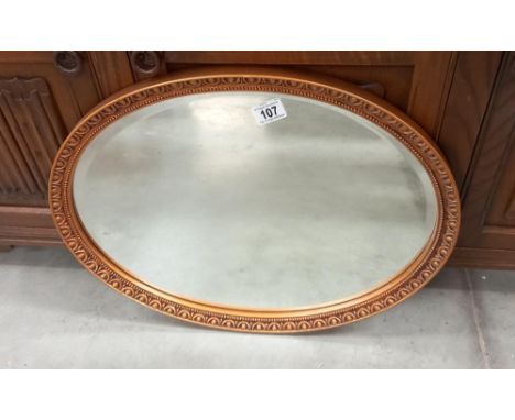 A vintage oval gilt framed bevel edged mirror COLLECT ONLY