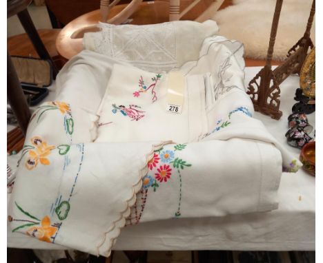 7 vintage tablecloths including one with Geisha girls and 2 smaller examples