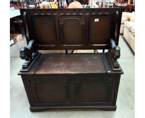 A vintage oak monks bench/storage box with lion arms COLECT ONLY