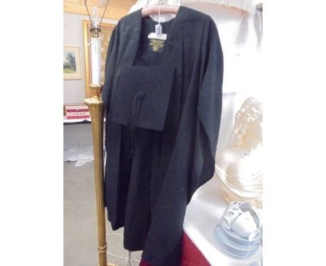 A graduation cloak and mortar board.