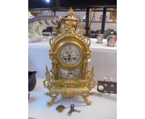 A french ormolu and enamel mantel clock.&nbsp;No visible damage, both springs ok