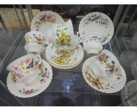 A set of six Royal Albert bird decorated tea cups and saucers, COLLECT ONLY.