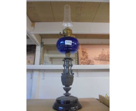 A Victorian spelter oil lamp with glass font. COLLECT ONLY.&nbsp;There is no damage to the font.&nbsp; Font under mount is st