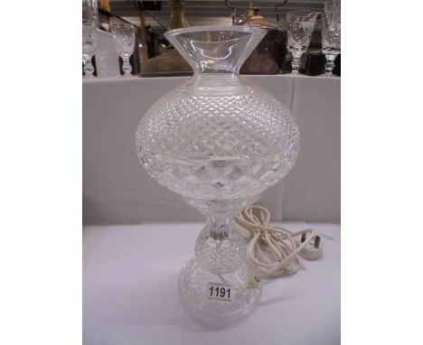 An art deco heavy cut glass table lamp. COLLECT ONLY.&nbsp;The shade has a chip to the bottom rim which is not visible when s