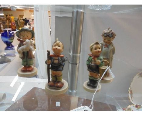 Four Goebel figures.