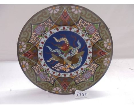 An early Chinese Cloissonne plate, 25 cm diameter.Diameter 24.5cm. No damage. usual sinkage to enamel in places