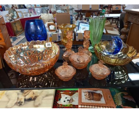 A selection of coloured glass including art deco pink trinket set, celery vase, carnival glass bowl etc