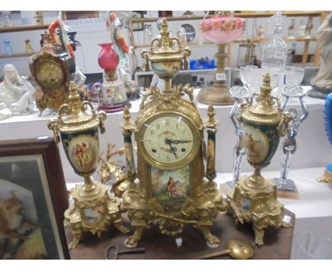 A three piece French clock set comprising ormolu and enamel clock with two sidepieces, COLLECT ONLY.&nbsp;No visible damage, 