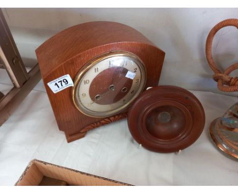 A 1930's oak mantle clock, no pendulum and a bowl made of teak from HMS Spartiate