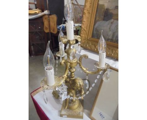 A candelabra style table lamp on cherub base, COLLECT ONLY.