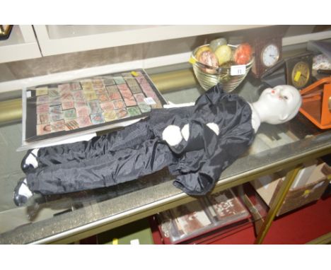 A bisque headed doll in the form of a Harlequin