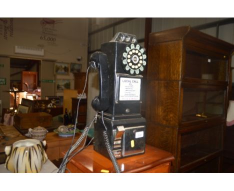 A retro rotary dial telephone