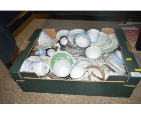 A box of various tea cups and saucers
