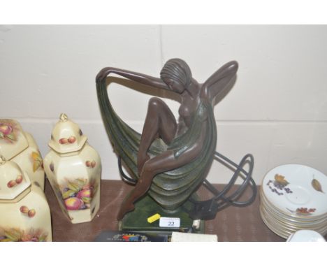 An Art Deco style table lamp base in the form of a reclining nude female