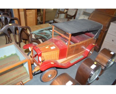 A large hand built wooden vintage car