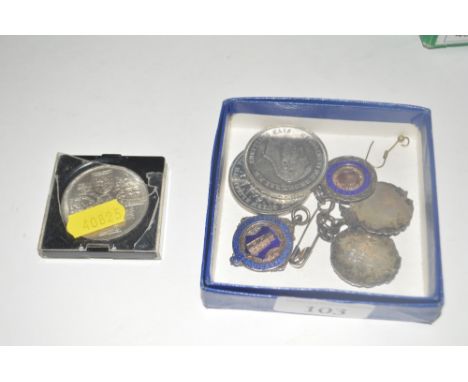 Three various silver and enamel decorated medal fobs; a white metal and enamel decorated medal fob and three crowns 