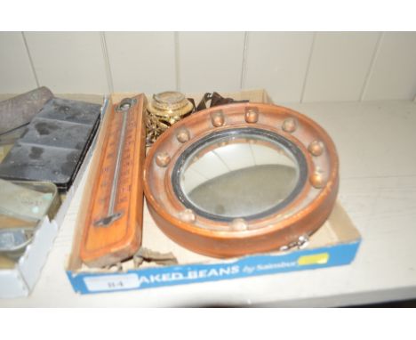 A tray of assorted items to include a small convex mirror, a wooden cased thermometer, a small gilt metal stand etc.