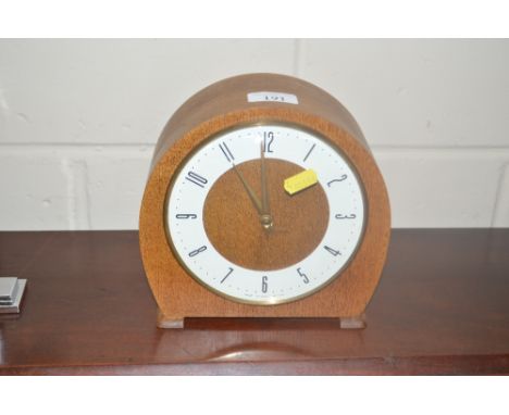 A light oak cased mantle clock