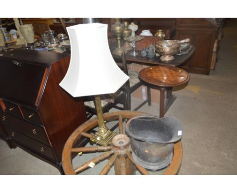 A copper coal scuttle and a brass table lamp