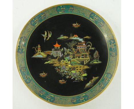 A Carltonware charger
with chinoiserie enamelled and gilded decoration, 15.25".