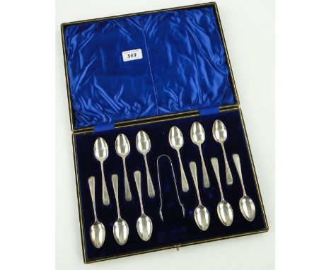 Cased set of silver Old English feather edge pattern teaspoons and tongs,
Sheffield 1927.