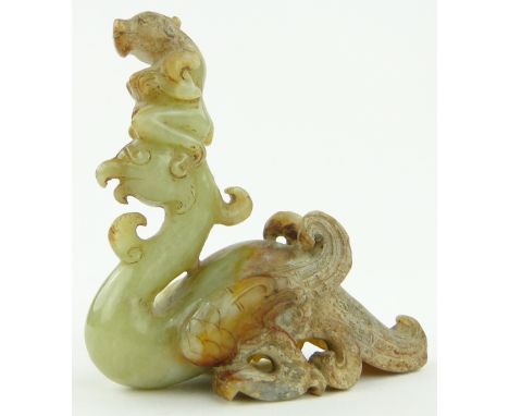 Chinese carved jade phoenix surmounted by a figure,
height 3.1".