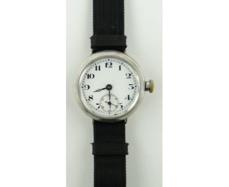 A First War period silver cased wristwatch,
with enamel dial, case width 34mm, GWO.