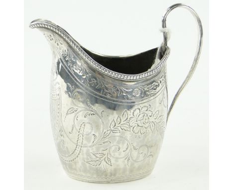 A George III bright cut silver helmet shaped cream jug,
makers marks A B, London 1794.