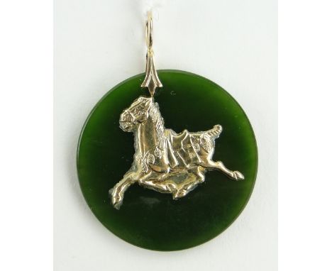 A Chinese jade and unmarked gold horse design pendant, width 30mm.