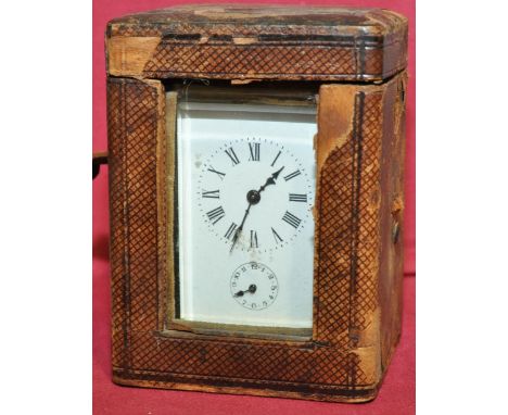 Brass cased carriage clock with alarm,
and key in original leather carrying case, clock height 4.25".
