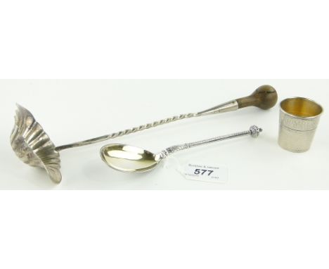 3 various silver items,
comprising; a Victorian spoon, unmarked continental toddy ladle and a thimble design drinking tot, (3