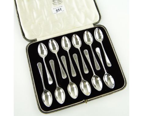 Cased set of 12 silver Old English feather edge pattern teaspoons,
Sheffield 1929.