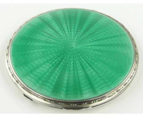 Art Deco silver and green enamel compact,
8.5cm across.