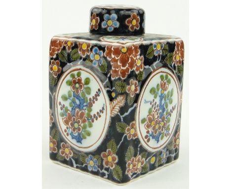 A Dutch Makkum tea caddy
with floral design, height 5.25".